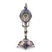 AN AUSTRIAN SILVER AND ENAMEL FIGURAL STANDING CLOCK