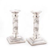 A PAIR OF CHINESE SILVER CANDLESTICKS