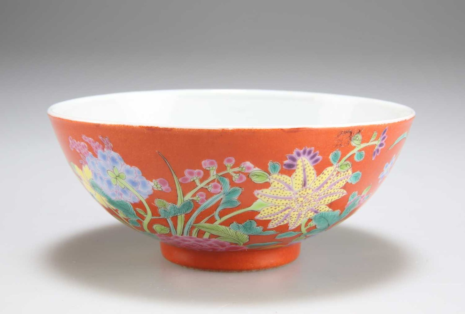 A CHINESE CORAL-GROUND ENAMELLED 'FLORAL' BOWL