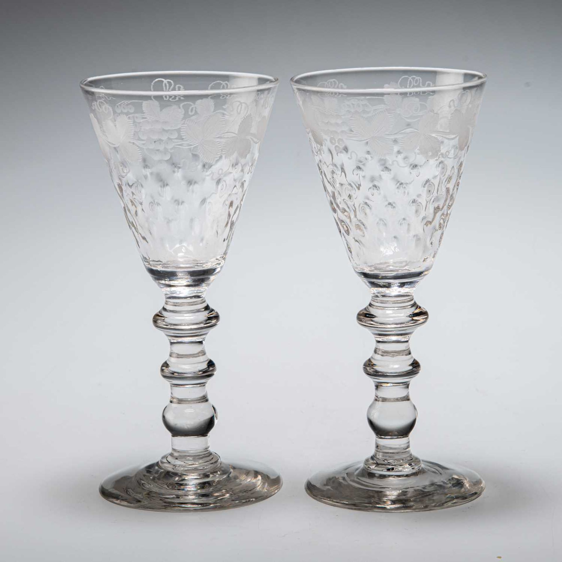 A PAIR OF WINE GLASSES