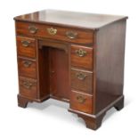 A GEORGE III MAHOGANY KNEEHOLE DESK