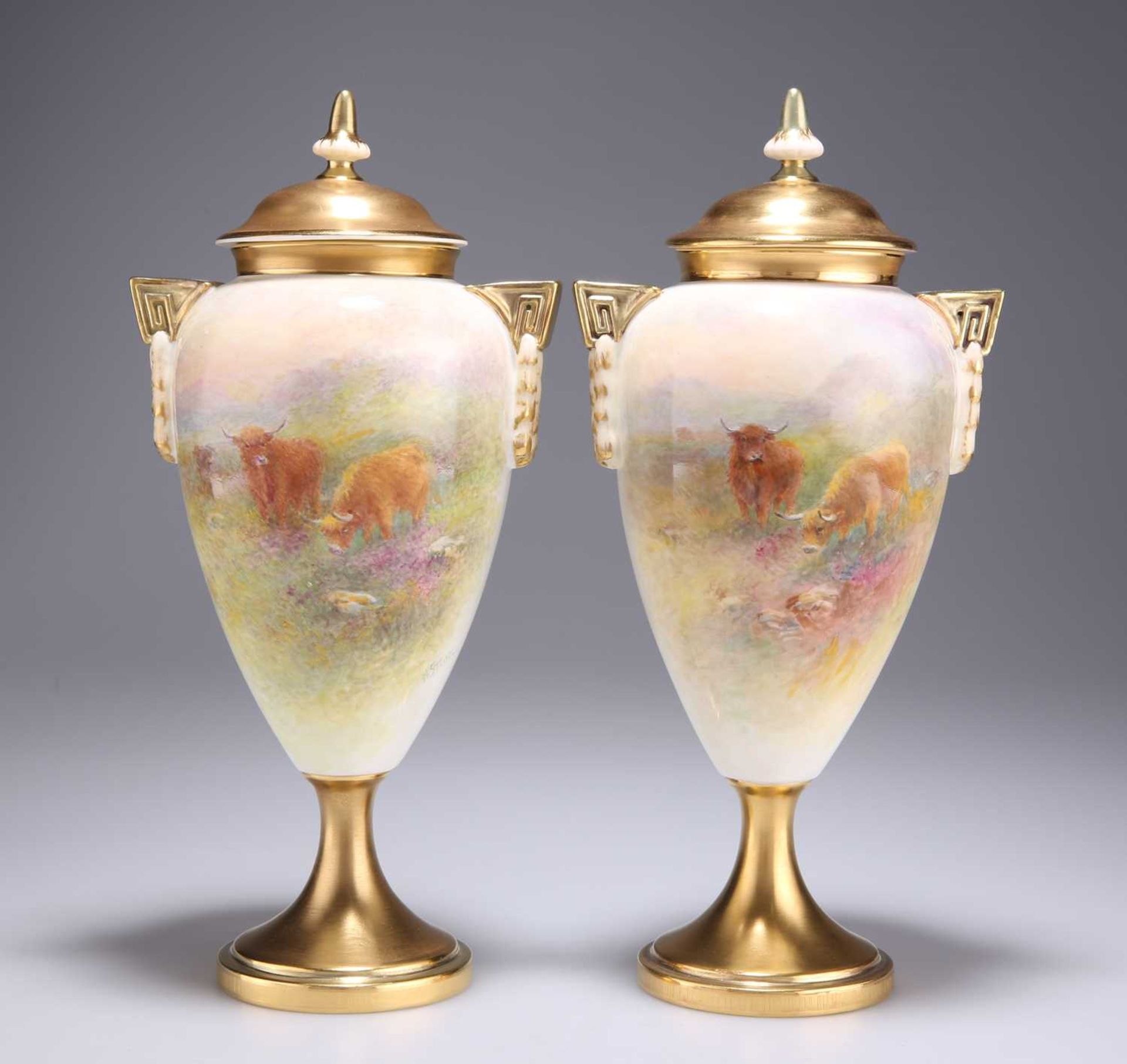 A PAIR OF ROYAL WORCESTER VASES AND COVERS