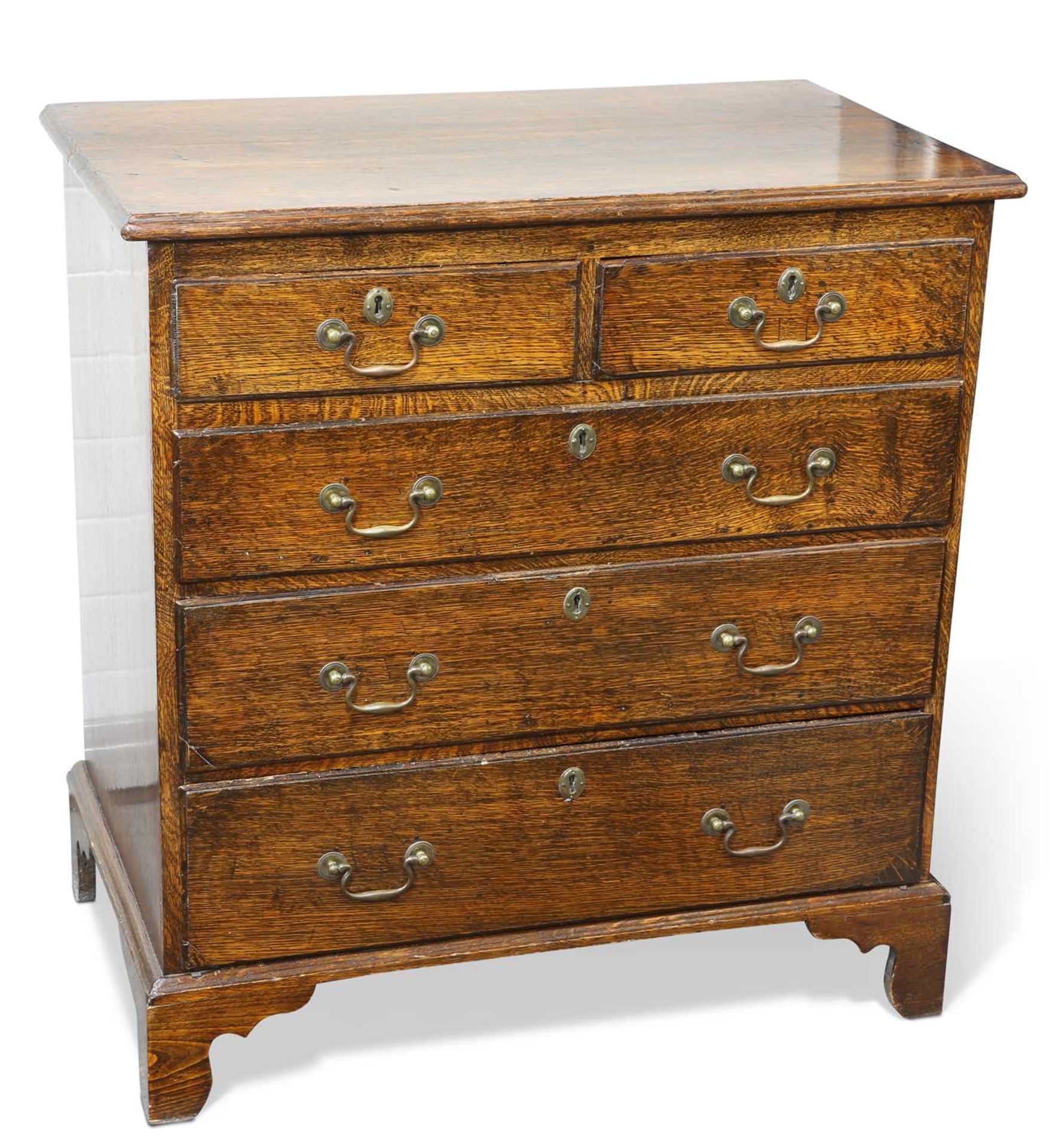 A GEORGE III OAK CHEST OF DRAWERS