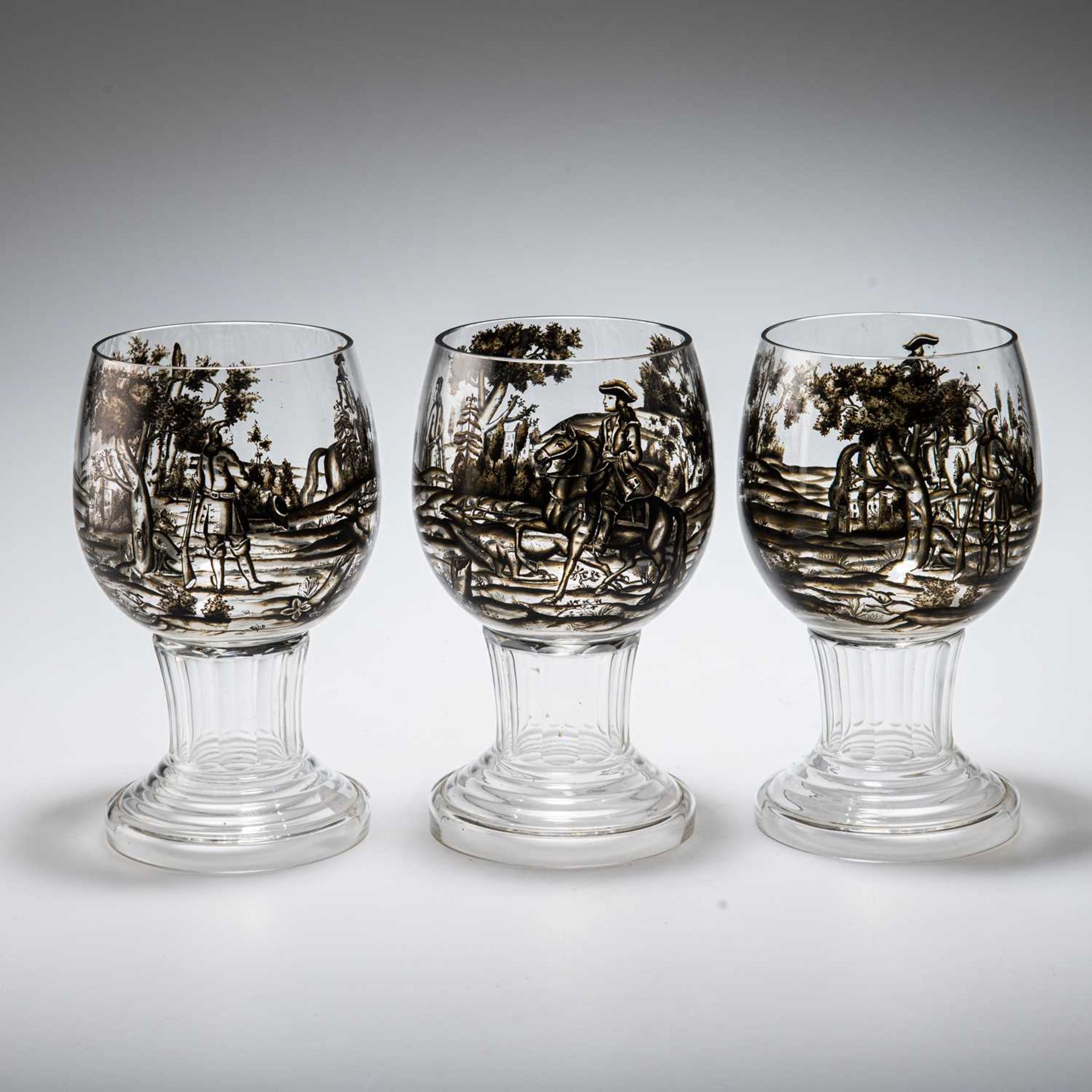 ATTRIBUTED TO JOSEF LENHARDT OF STEINSCHÖNAU, THREE SCHWARZLOT GLASS GOBLETS