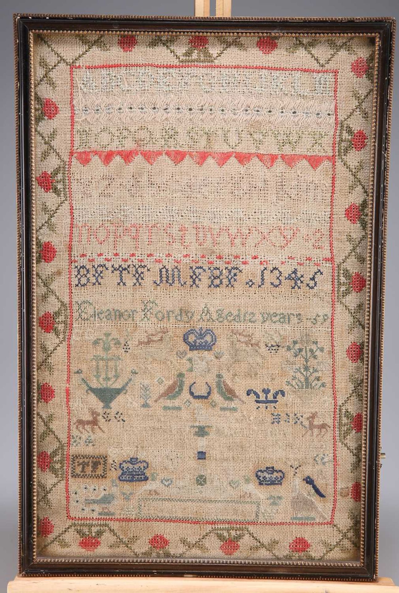 A 19TH CENTURY NEEDLEWORK SAMPLER