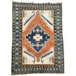 AN ORIENTAL TRIBAL RUG