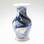 A CHINESE BLUE AND WHITE DRAGON AND CARP VASE