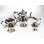 A VICTORIAN SILVER-PLATED THREE-PIECE TEA SERVICE