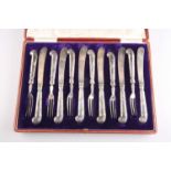A SET OF SIX PAIRS OF EDWARDIAN SILVER-HANDLED DESSERT KNIVES AND FORKS