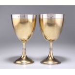 A LARGE PAIR OF VICTORIAN SILVER-GILT GOBLETS