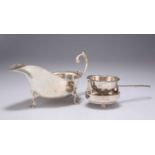 A GEORGE V SILVER SAUCE BOAT, AND A FOREIGN SILVER TEA STRAINER