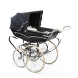 A 1970S SILVER CROSS PRAM