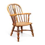 A GOOD 19TH CENTURY YEW WOOD CHILD'S WINDSOR ARMCHAIR