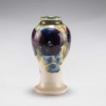 A WILLIAM MOORCROFT SMALL BURSLEM 'PANSY' PATTERN POTTERY VASE