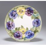 A WILLIAM MOORCROFT 'PANSY' PATTERN POTTERY SIDE PLATE