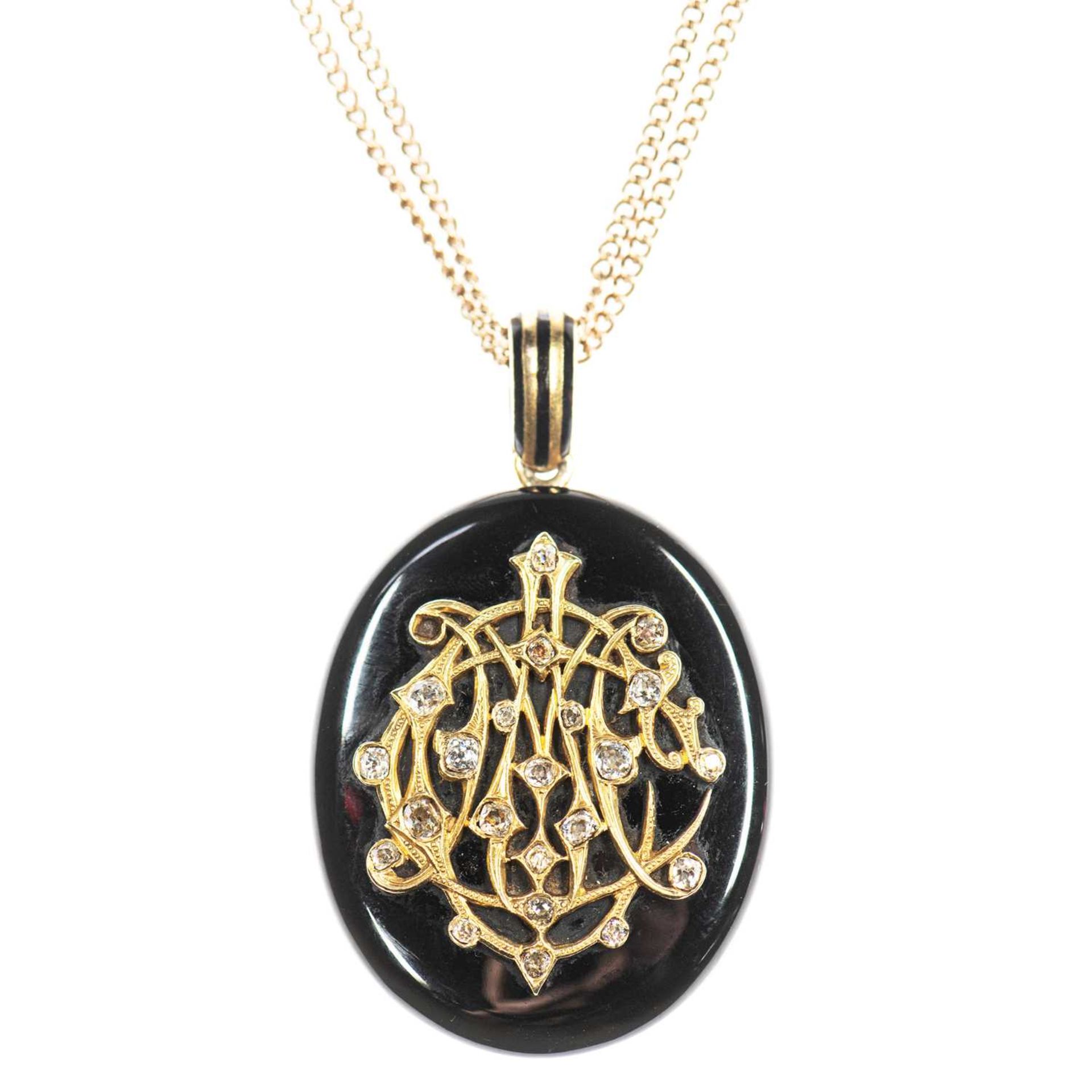 A VICTORIAN ONYX AND DIAMOND MOURNING LOCKET PENDANT ON CHAIN