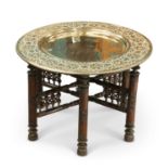 A MOORISH CIRCULAR BRASS TRAY-TOP TABLE, CIRCA 1900