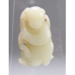 A CHINESE CARVED JADE FIGURE