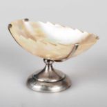 AN EDWARDIAN SILVER-MOUNTED MOTHER-OF-PEARL SHELL SALT