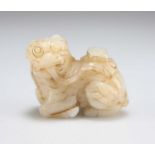 A CARVED JADE QILIN