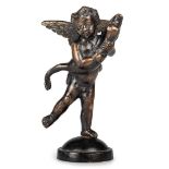 A PATINATED BRONZE MODEL OF A PUTTO WITH A DOLPHIN