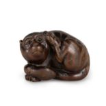 A JAPANESE FRUITWOOD NETSUKE