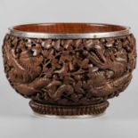 A 19TH CENTURY BURMESE HARDWOOD BOWL WITH A WHITE-METAL RIM