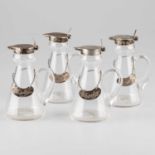 A SET OF FOUR EDWARDIAN SILVER-MOUNTED WHISKY NOGGINS