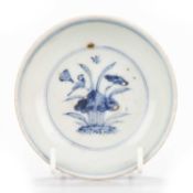 A CHINESE BLUE AND WHITE HOLE BOTTOM DISH, MING 15TH CENTURY