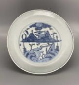 A CHINESE BLUE AND WHITE LANDSCAPE DISH, WANLI (1572-1620)