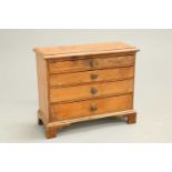A MID-19TH CENTURY PINE MINIATURE CHEST OF DRAWERS