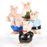 A FAMILY OF NATWEST PIGGY BANKS, BY WADE