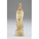 A CARVED JADE FEMALE FIGURE