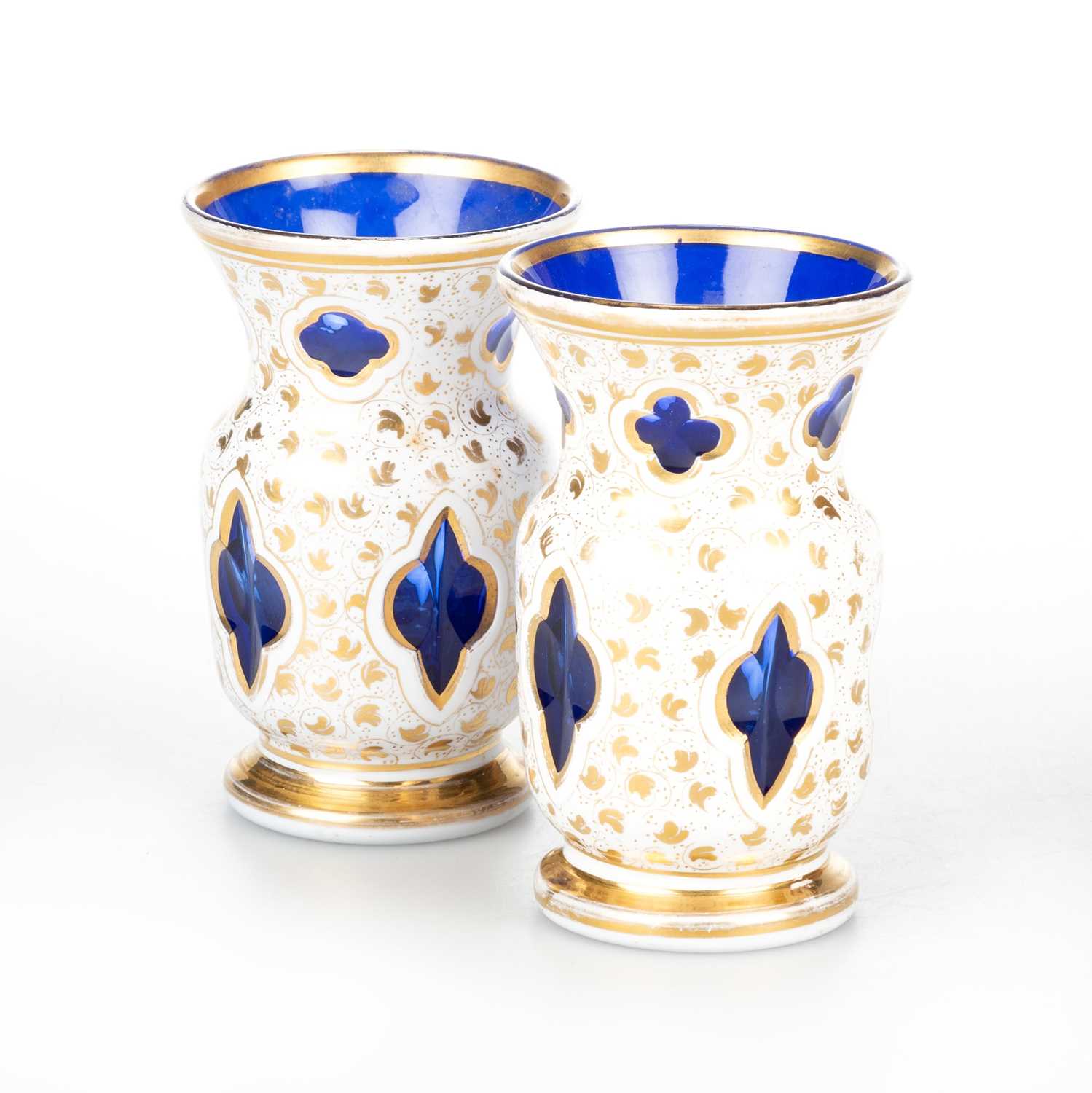 A SMALL PAIR OF 19TH CENTURY BOHEMIAN OVERLAY GLASS VASES