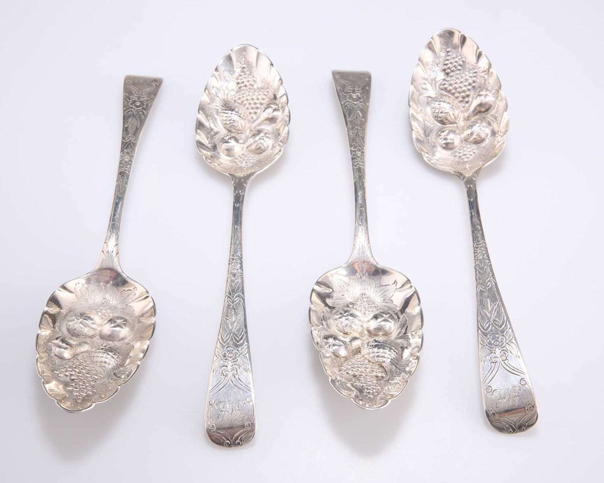 A SET OF FOUR GEORGE III SILVER TABLE SPOONS