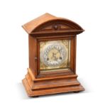 AN OAK MANTEL CLOCK, CIRCA 1900