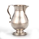 A GEORGE II SILVER SPARROW-BEAK CREAM JUG