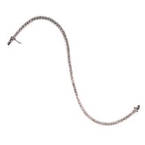 AN 18K WHITE GOLD AND DIAMOND TENNIS BRACELET