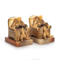 A PAIR OF 20TH CENTURY NOVELTY GILT-METAL AND ONYX BOOKENDS