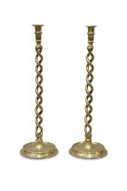 A PAIR OF LARGE BRASS CANDLESTICKS