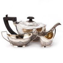 A LATE VICTORIAN SILVER BACHELOR'S THREE-PIECE TEA SERVICE