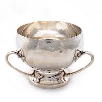 AN ARTS AND CRAFTS IRISH SILVER THREE-HANDLED BOWL