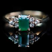 A 9CT YELLOW GOLD EMERALD AND CZ RING