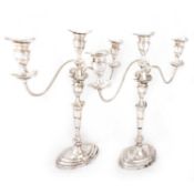 A PAIR OF SILVER-PLATED CANDELABRA