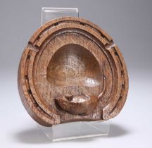 ROBERT THOMPSON OF KILBURN, A CARVED OAK HORSE HOOF-SHAPED ASHTRAY