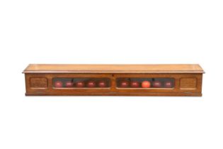 AN OAK WALL-MOUNTED SNOOKER BALLS CASE, LATE 19TH/ EARLY 20TH CENTURY