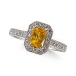 A YELLOW SAPPHIRE AND DIAMOND CLUSTER RING, IN PLATINUM MOUNT.