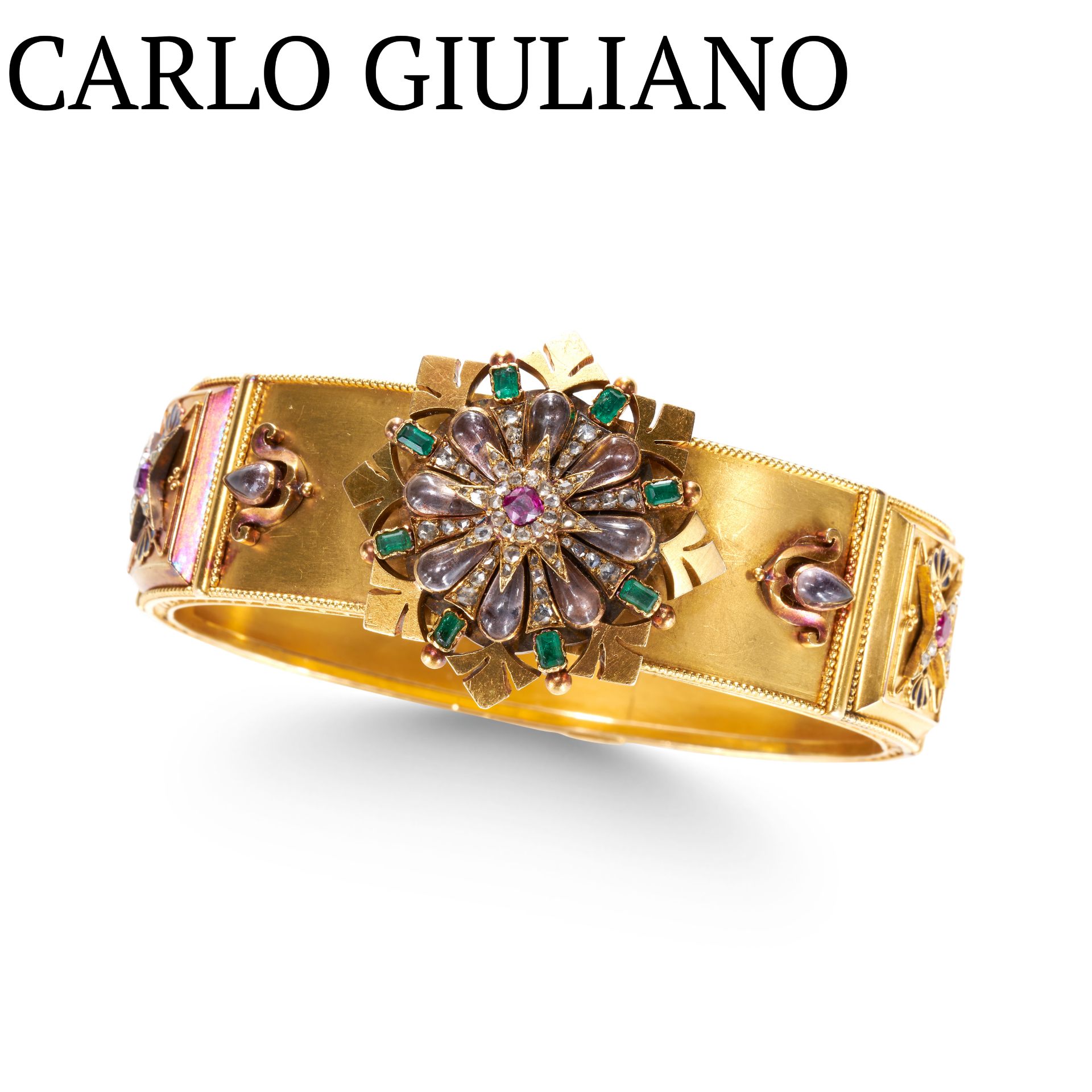 CARLO GIULIANO, AN IMPORTANT RUBY, EMERALD DIAMOND, MOONSTONE AND ENAMEL BANGLE, IN YELLOW GOLD.