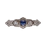 AN EDWARDIAN GOLD AND SILVER BROOCH SET WITH DIAMONDS AND SYNTHETIC CABOCHON SAPPHIRE.