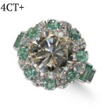 AN IMPORTANT ROUND BRILLIANT DIAMOND AND EMERALDS CLUSTER RING IN PLATINUM MOUNT.